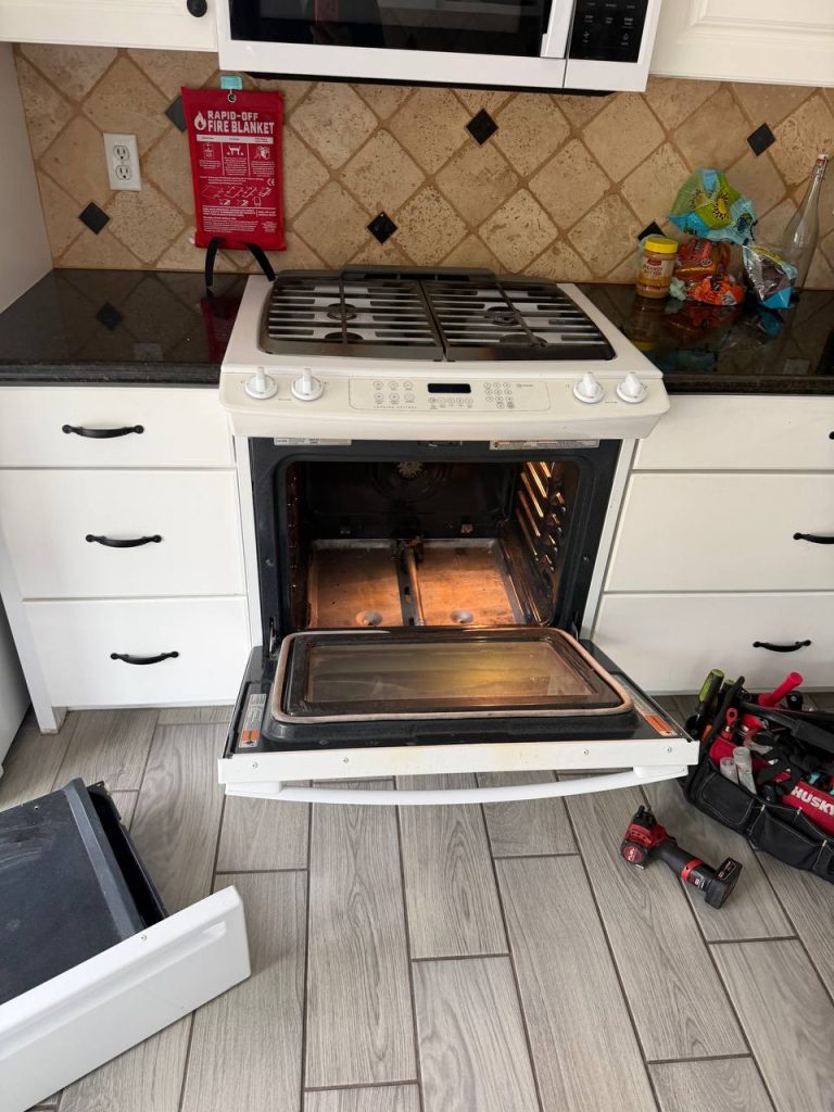 Whirlpool oven opened for a bake igniter replacement in Orange County